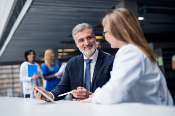 Doctor talking to a pharmaceutical sales representative.