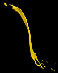 Wall Mural - yellow paint splash isolated on black background