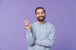 © Drobot Dean - Positive happy young man showing peace gesture.