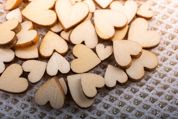 Wall Mural - Wooden hearts form round shape on white background