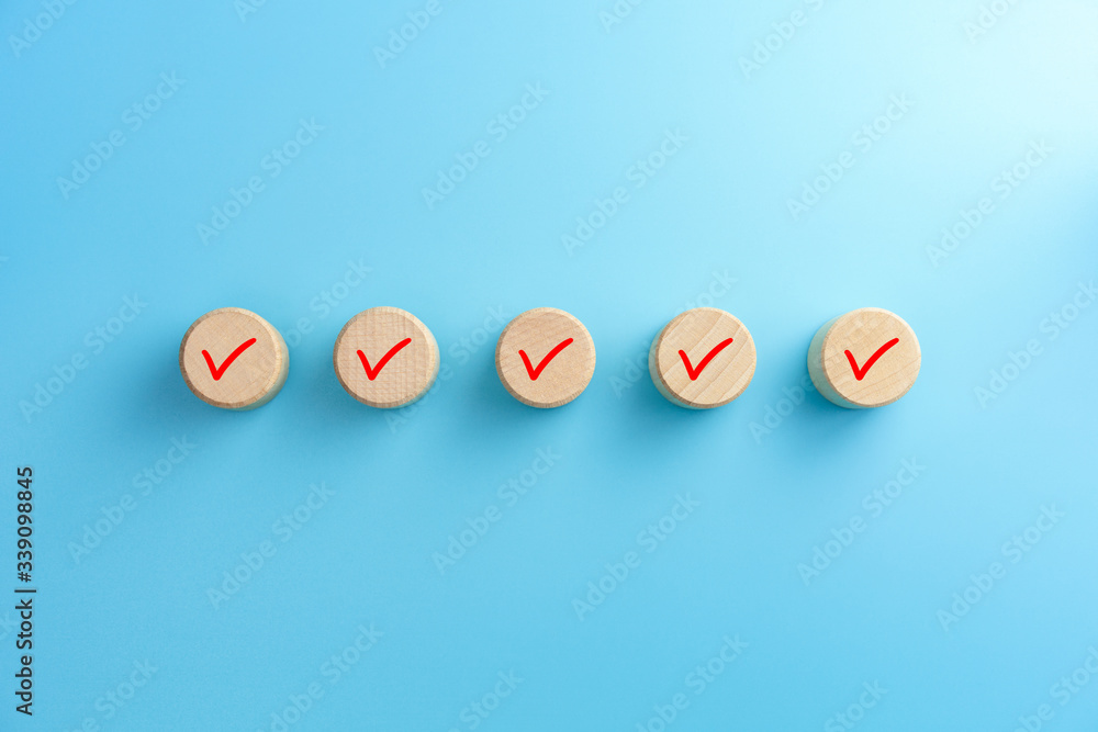 Checklist concept, Check mark on wooden blocks, blue background with ...