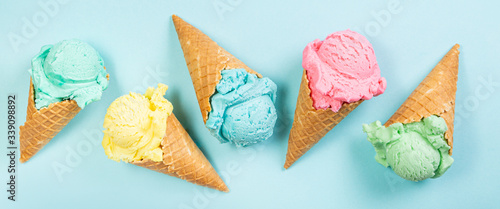 Cuadros en Lienzo Pastel ice cream in waffle cones, bright background, copy space