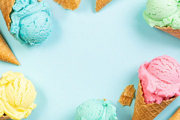 pastel ice cream in waffle cones, bright background, copy space