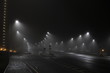 © phormes - quarantine isolation, night road in the fog, no people, no cars, light misty car in road in verry foggy horror creepy