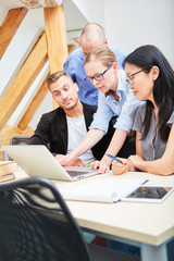software developer team on laptop computer