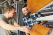 © Robert Kneschke - Two furniture makers discuss a workpiece