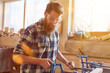 © Robert Kneschke - Carpenter works on vise in carpentry