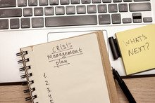 Crisis Management Plan Written Words In Notebook