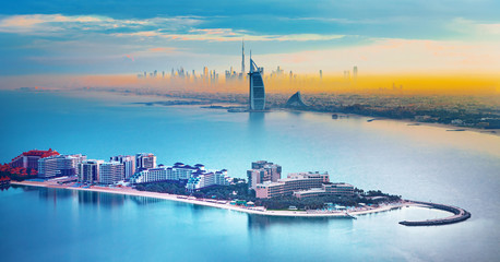 Wall Mural - Dubai city center and famous Jumeirah beach skyline at sunset, United Arab Emirates