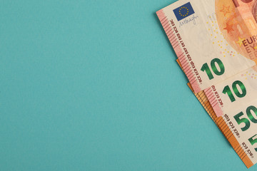 lending, deposits, foreign exchange transactions, money transfers. Euro notes with copyspace on a blue background