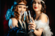 © kohanova1991 - Beautiful flappers women dressed in style of Roaring twenties drinking champagne. Vintage, retro party, fashion, girls friends concept
