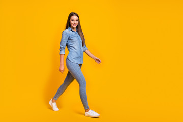 Wall Mural - Full length photo of attractive sweet nice girl go walk enjoy holiday time with friends wear modern youth outfit gumshoes isolated over shine color background