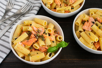 Wall Mural - Lemon Garlic Pasta with Salmon: Rigatoni with chunks of salmon tossed with olive oil, basil, and lemon