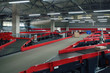 © Mykola - conveyor sorting belt at distribution warehouse. Distribution hub for sorting packages