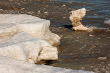 A Remnant Of An Off-shore Ice Island, Eroding At The Base From The Wave Action Of Lake Michigan Just Offshore Of Harrington Beach State Park, Belgium, Wisconsin In Late February