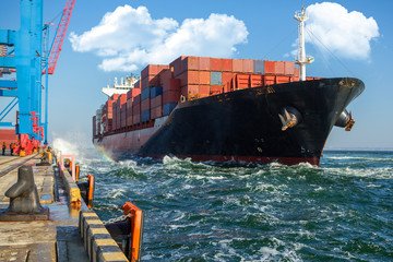 Wall Mural - Container ship in port at container terminal. Ships of container ships stand in terminal of port on loading, unloading container.