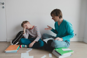 Wall Mural - father explaining homework to stressed kid, tired of learning