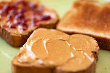 Wall Mural - Toasted whole wheat bread slices with peanut butter and jam