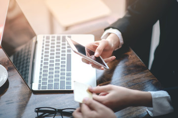 Businessman working on financial business via laptops and credit cards