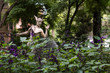 Hermes sculpture in purple garden