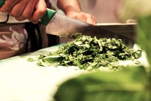 Close-up Of Leafy Vegetables On Chopping Board
