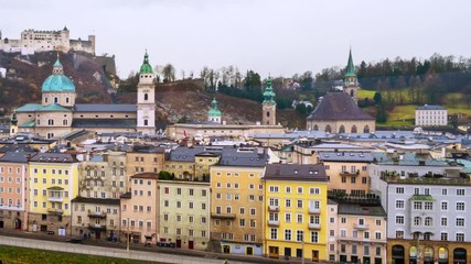 Sticker - Salzburg, Austria. View of Salzburg, Austria in the cloudy day. Castle and other historical buildings. Dark fast pacing sky, time-lapse, panning video