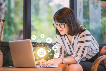 working at home self-quarantine staying safe from coronavirus COVID-19 pandemic concept, beautiful asian businesswoman smiling working using laptop planning finance and business brainstorming ideas