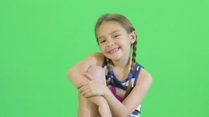 positive confident child in star muscular shirt sweatshirt. she comb the hair. happy eight years old
