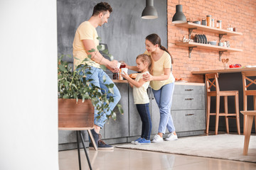 Sticker - Young family in kitchen at home