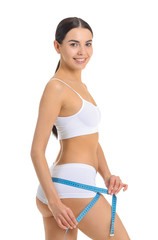 Sticker - Young woman with measuring tape on white background. Weight loss concept