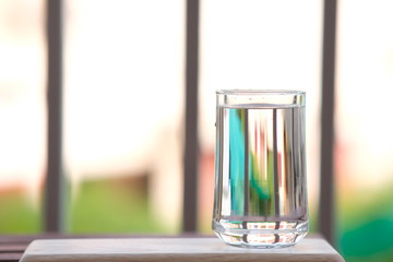 Poster - Water in glass on counter background and space for text 