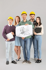 Poster - Group of young architects on grey background