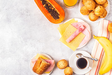 Traditional Brazilian breakfast - cheese bread, coffee, ripe fruit.