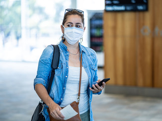 Wall Mural - Traveler with mask stuck in airport no able to return home country due to COVID-19 border closures.