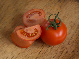 Fresh tomatoes on rustic wooden background