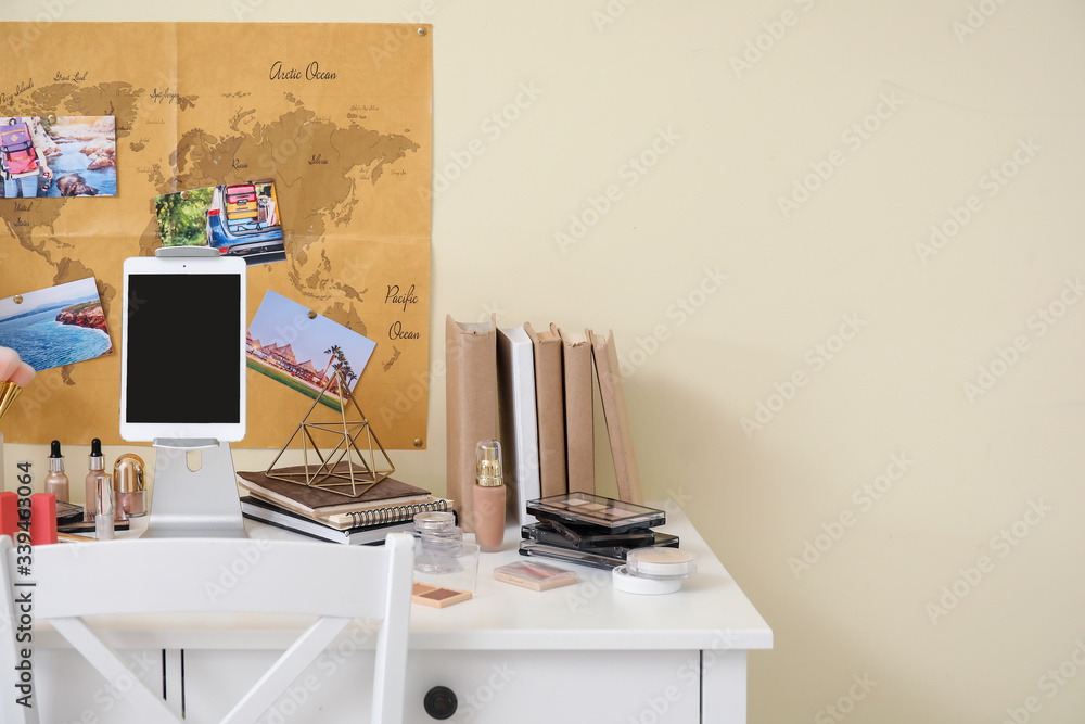 Workplace of professional makeup artist with tablet computer