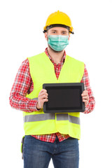 Wall Mural - Construction worker wearing protective face mask is presenting shockproof digital tablet