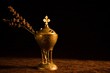 Beautiful church censer with a dried branch with a dark background