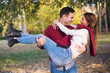 © Jelena - Couple enjoying autumn in park.