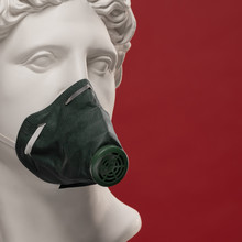 Protective Mask, Respirator On The Face Of The Statue Of Apollo
