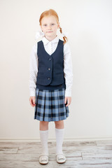 Wall Mural - Red-haired schoolgirl indoors