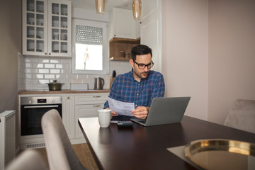 Accountant work from home on a laptop.