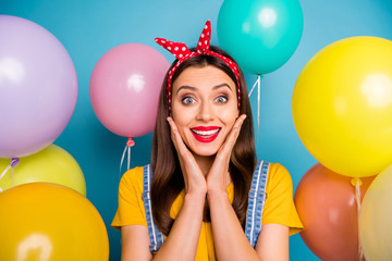 Poster - Close-up portrait of her she nice-looking attractive lovely pretty charming cute cheerful cheery glad girl having fun among air balls isolated over bright vivid shine vibrant blue color background