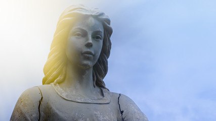 Angel statue bathed in spiritual light