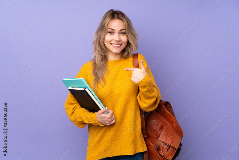Teenager Russian student girl isolated on purple background with surprise facial expression - obrazy, fototapety, plakaty 