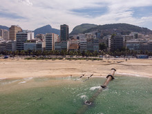 Strong Tidal Wave Washed Away The Sand Of Ipanema Beach Revealing A Large Pipeline Construction Leading From The Neighbourhood Into The Ocean With The Corcovado Mountain In The Background