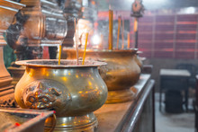 Incense Burning In A Big Bronze Cauldron. Man Mo Temple, Hollywood Road, Hong Kong Island, China. Beautiful Interior Close Up In This Religious Site.
