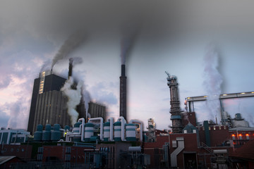 Wall Mural - Polluting factory on bright sky, with some 3d-effect to emphasize the smoke and the buildings.