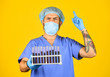 © be free - creation of antiviral vaccine. first phase of clinical trials. doctor wear mask. medical scientist hold test tubes. work in chemical lab. outbreak of new coronavirus. infection is caused by virus
