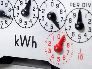 Electric meter dial close-up, focus on KWH symbol. Concept for energy, bills, reading, Winter fuel payments and cost of living.